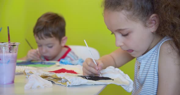 Happy Cute Children a Girl of 78 Years Old and Preschool Boy Paint at Home with Watercolors Sitting