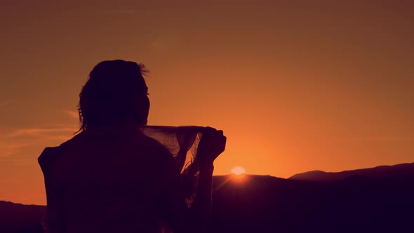 Young Woman Relaxing in Summer Sunset Sky Outdoor