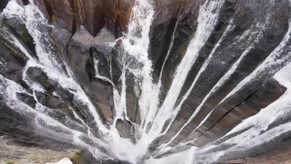 Epic aerial view to the huge mountain waterfall with clean and purity water
