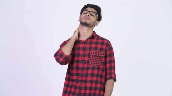 Young Stressed Bearded Indian Hipster Man Having Neck Pain