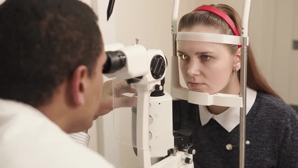 Portrait of a Student Who Checks Eyesight on an Ophthalmological Apparatus