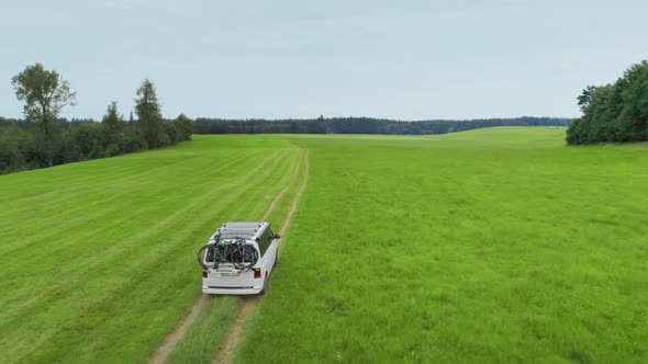 Small Camping Van with Bike Rack on Country Road