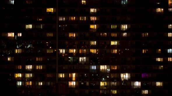 Night Time Lapse of Light in the Windows of a Multistory Building