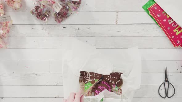 Flat lay. Step by step. Packaging homemade fudge and cookies into a Christmas gift box