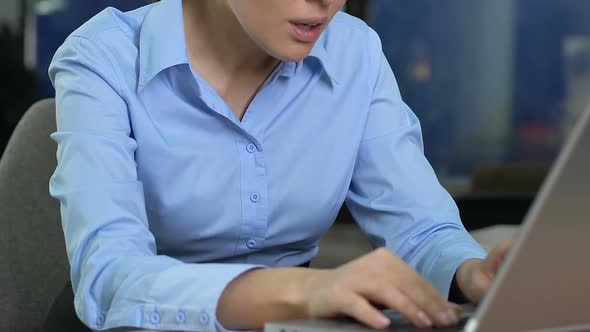 Annoyed Business Lady Working on Laptop, Irritated by Bad News, Job Trouble