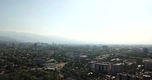 Green City with Snowy Mountains of Almaty