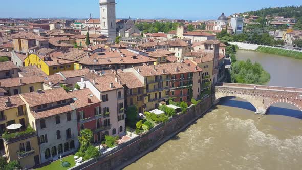 Panoramic aerial drone view of Verona, Italy. The drone is spinning over the river Adige