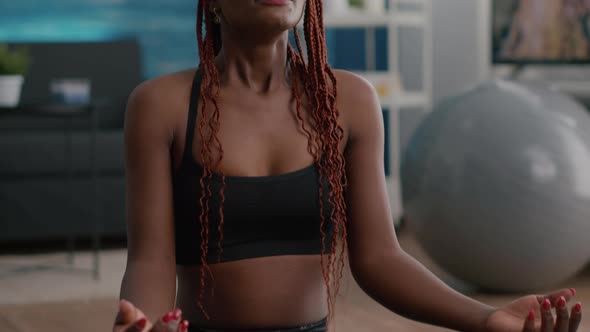 Flexible Fit Black Woman Practicing Respiratory Exercise During Morning Fitness Sport