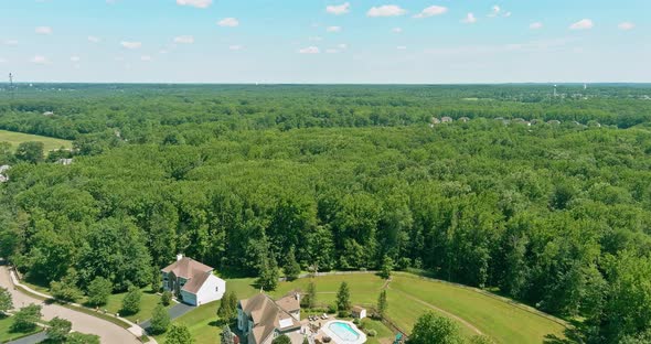 Aerial View with Residential Sleeping Area Street Between the Forest the a Monroe Town Area in New