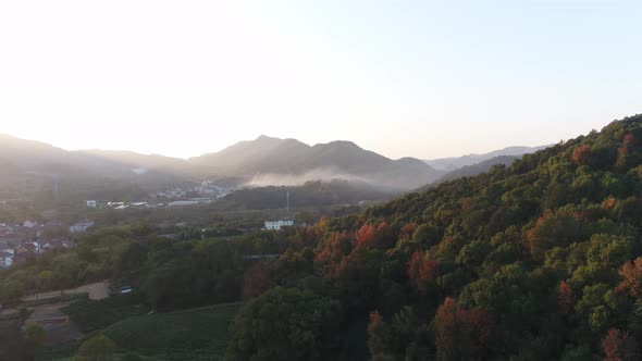 Mountain village and farmland in the sunset