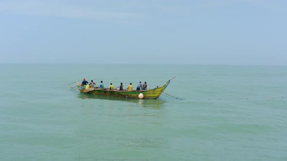 _Aerial shot of a boat or canoe fishing in a sea during the day_25