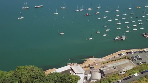 Beautiful aerial reveal of a marina full of sail boats