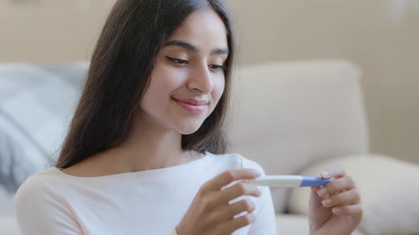 Portrait of Joyful Happy Pregnant Woman Future Mom Sits at Home Holds Pregnancy Positive Test Result