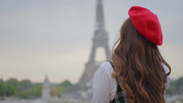 Beautiful young woman spending time in Paris.