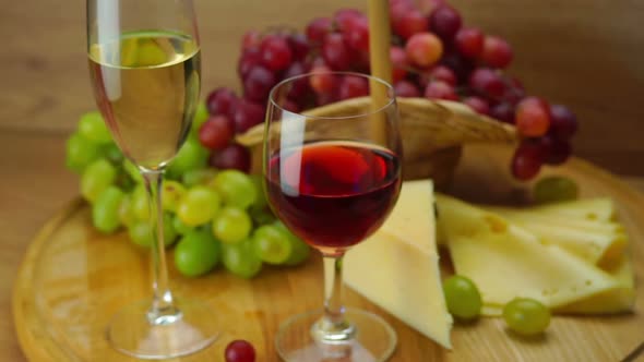 Plate with Grapes, Cheese and Glasses of Wine