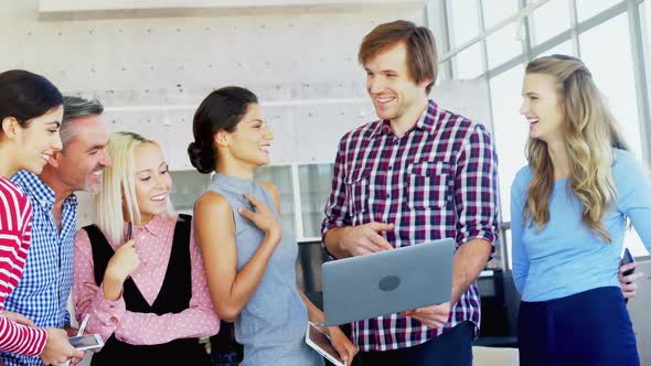 Colleagues discussing in the office 4K 4k