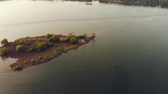 Aerial View on Sunset on Riverbed and Small Bird Island in Goa.