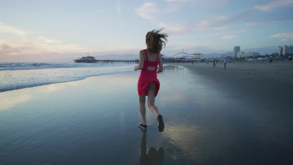 Girl running on Santa Monica beach