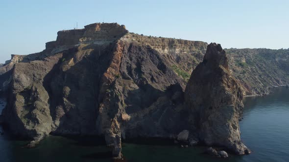 Aerial View From Above on Calm Azure Sea and Volcanic Rocky Shores