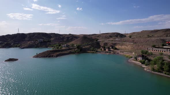 Flying Over a Lake with Islands and Rocks