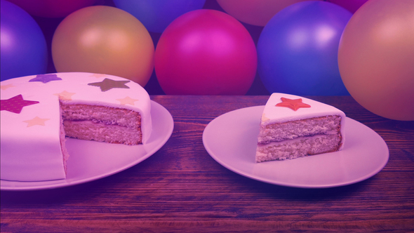 Slice Of Birthday Cake At Party In Colorful Lights