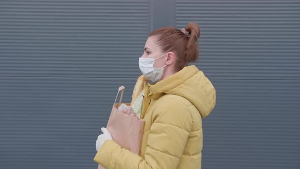 Young Woman with Purchases From the Supermarket