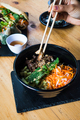 Eating colorful Vietnamese salad with chopsticks - PhotoDune Item for Sale