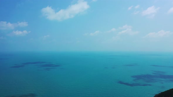 Endless ocean with a shadow from the clouds on the water surface. Philippine coast