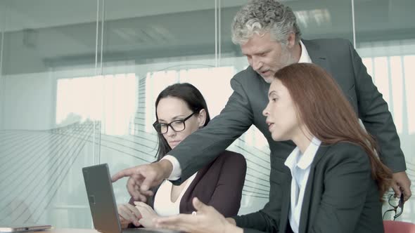 Senior Manager in Pointing in Laptop Monitor and Showing