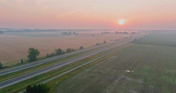 Panorama Landscape View in Sunrise Over the Meadow Across High Speed Highway in the Morning Fog in