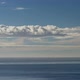 Clouds Moving Through A Beautiful Blue Sky Over The Ocean - VideoHive Item for Sale