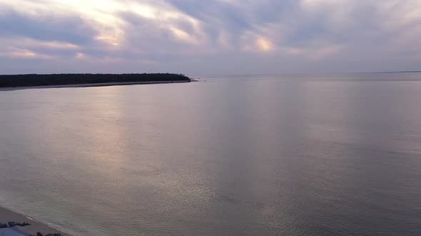 An aerial view over the Long Island Sound by Orient Point on Long Island, New York during a golden s