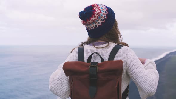 Back View of Young Attractive Girl Enjoing View of Mountain Landscape and Ocean Slow Motion