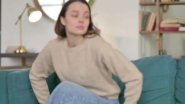 Young Woman Closing Laptop Going Away From Sofa 