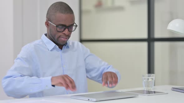 African Man Coming To Office Work Opening Laptop