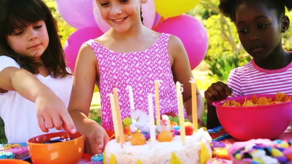Girl celebrating her birthday with her friends alt