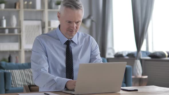 Loss Frustrated Gray Hair Businessman Working on Laptop