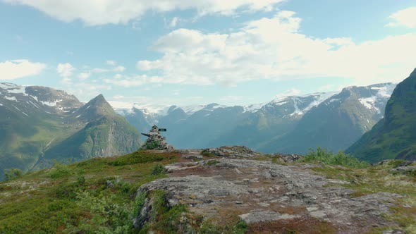 Revealing Shot Of Klovane And Oldevatnet From Mountain Peak In Olden, Norway On A Sunny Day. aerial