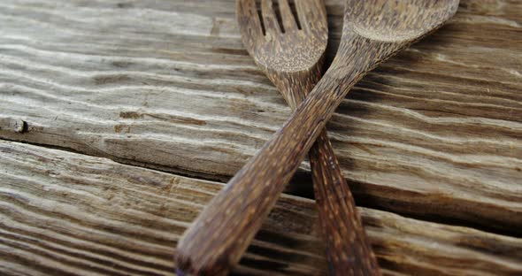 Wooden spoon and fork on table