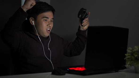 happy man using joystick to playing games