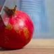 Women cuts a pomegranate with a knife - VideoHive Item for Sale