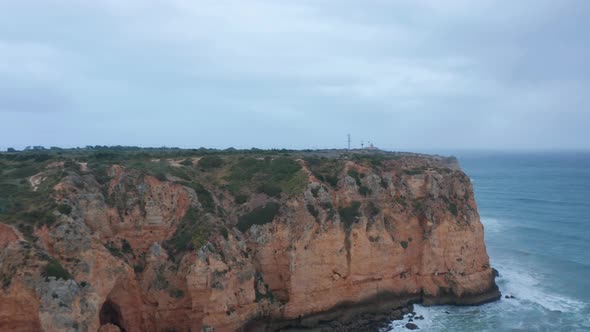 Sensational Aerial Drone View Flying Above Lagos Portugal Coastline Cloudy Day Flying Forward