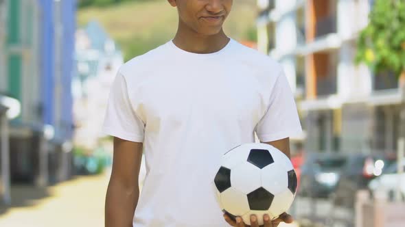 Slim Boy Holding Soccer Ball