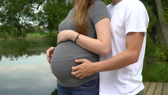 Man Hugs his Pregnant Wife