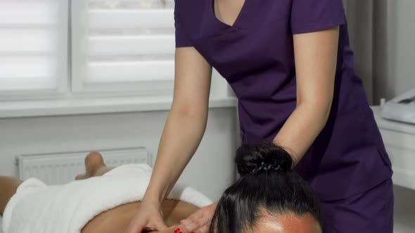 Beautiful Masseuse Smiling To the Camera While Working at Spa Center