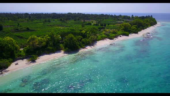 Aerial scenery of paradise shore beach trip by blue ocean with white sand background of a picnic aft