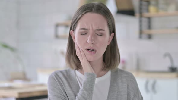 Portrait of Sick Young Woman with Toothache