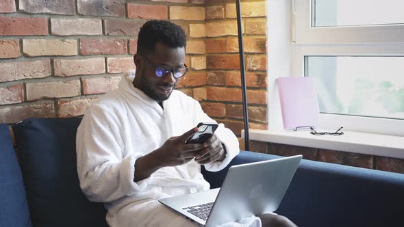 Confident African Man Work on Laptop at Home