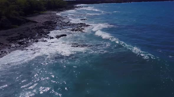 Flying Over The Rugged Coastline Of Hawaii
