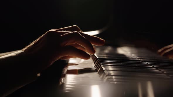 Male Hands Touch Piano Keys and Play Fast Jazz Melody